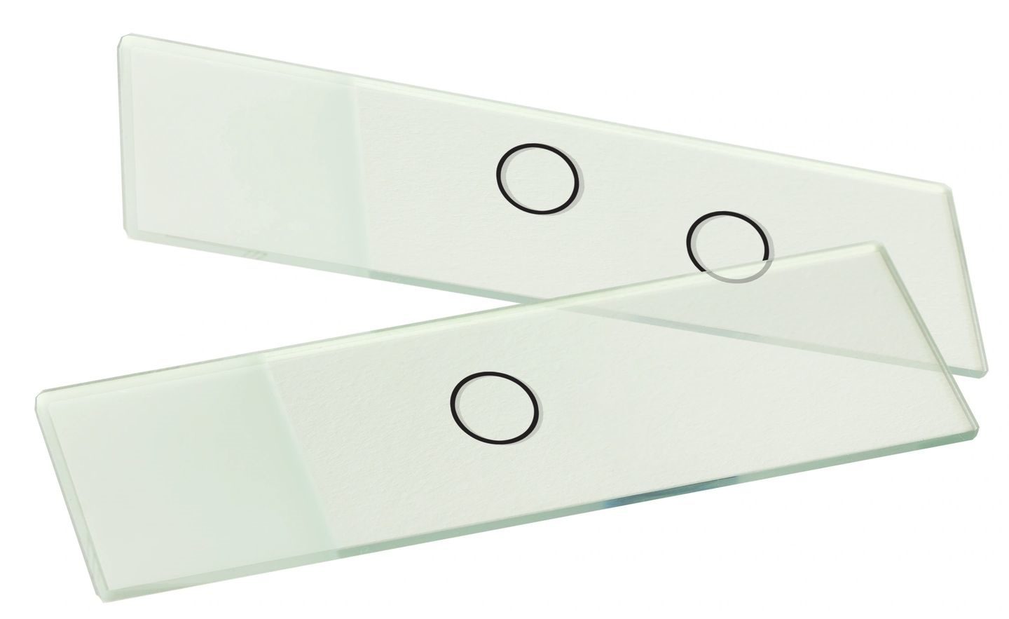 A pair of white scissors with black circles on them.