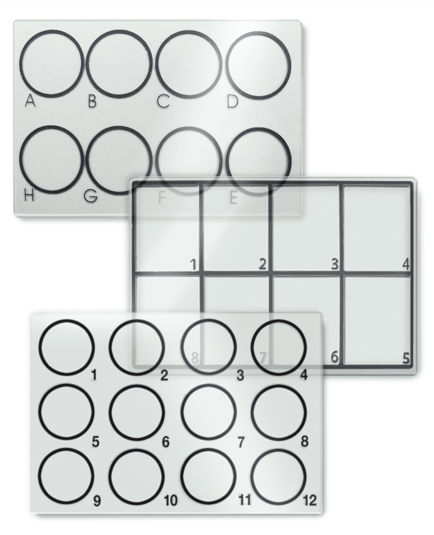 A set of three different size trays with numbers and circles.